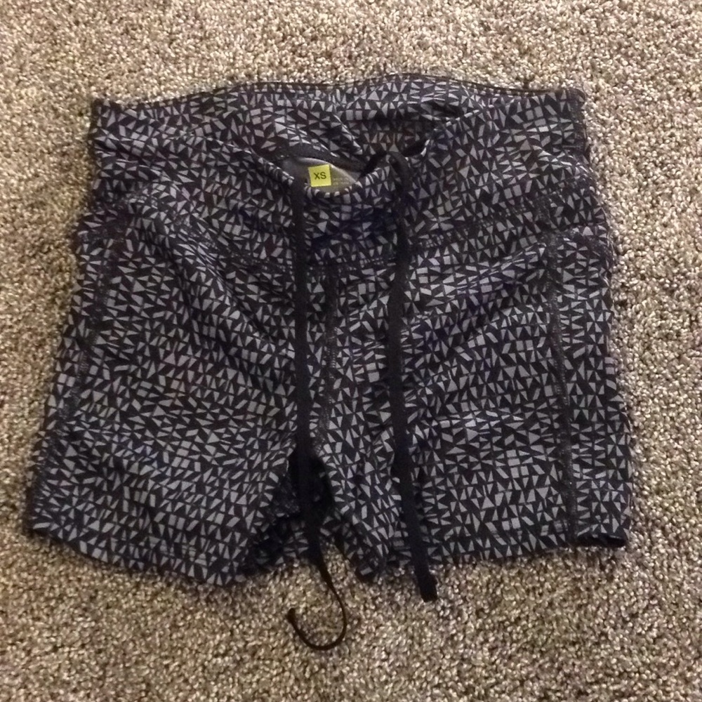Black shorts with grey triangles.